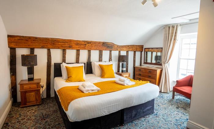 A room with a king size bed